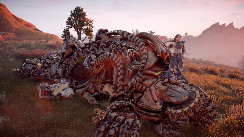 Aloy standing on a dead machine