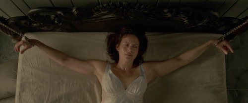Carla Gugino tied to a bed, viewed from above