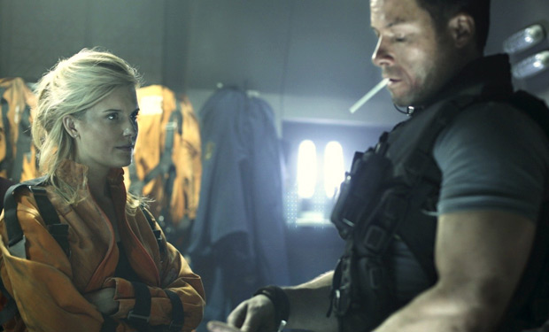 Guy Pearce and Maggie Grace in Lockout